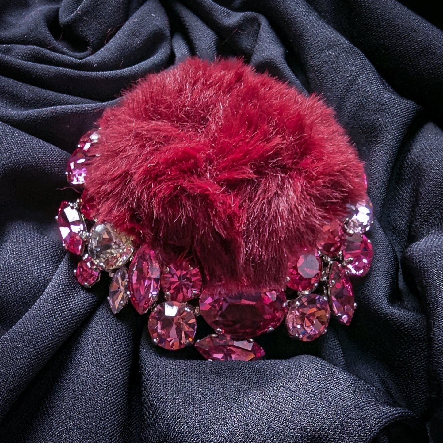 DG ornament: burgundy fur pom-pom surrounded by pink and rose Swarovski crystals.