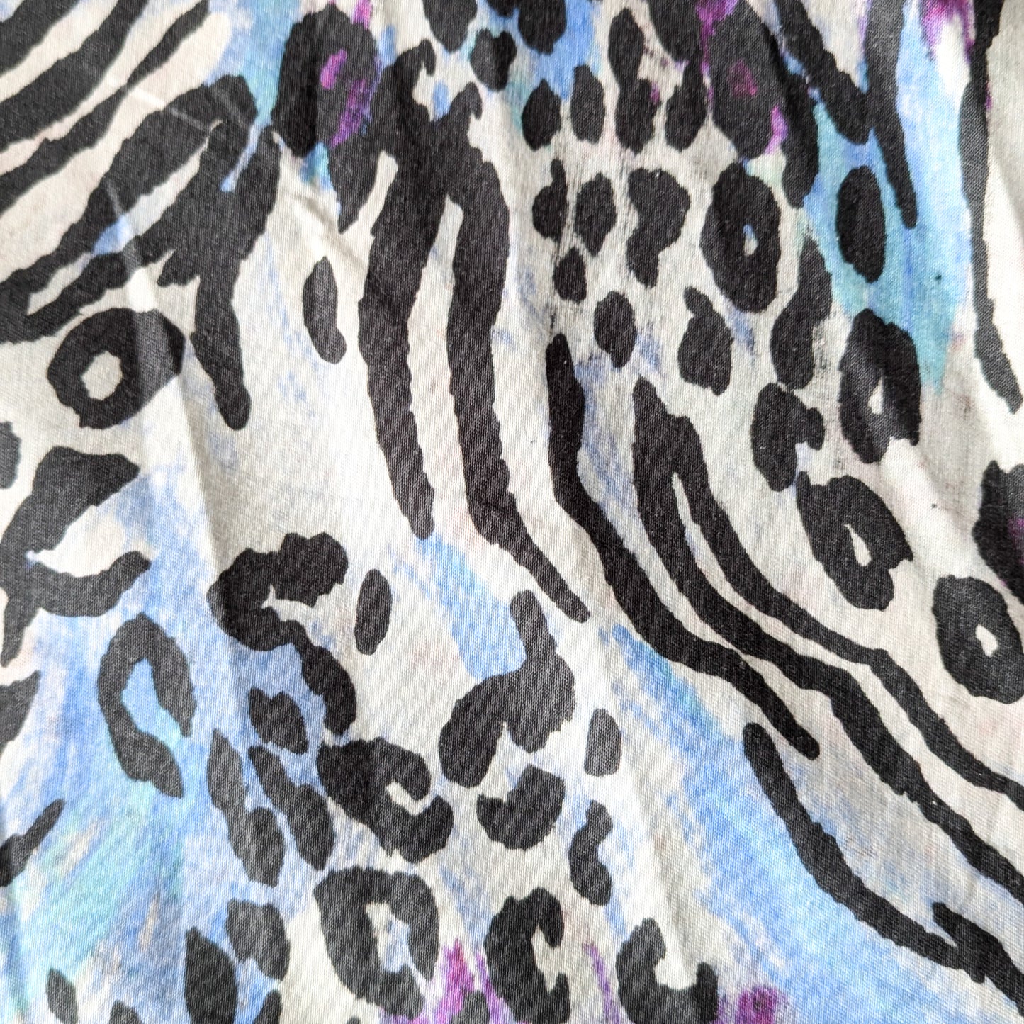 Deadstock Patrizia Pepe double-sided denim with black leopard and zebra print on white and blue.