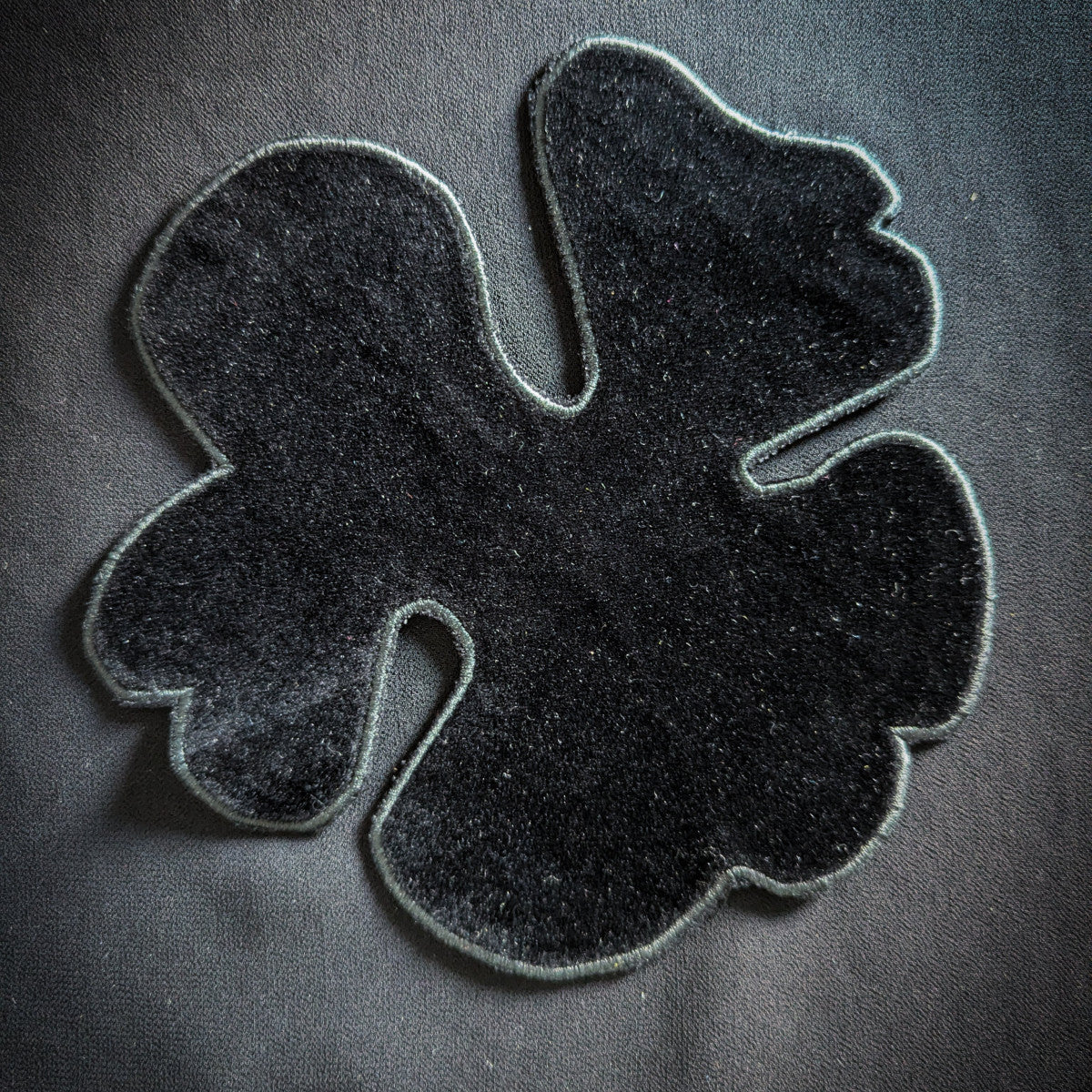 D&G black velvet patch, 15x16cm, with a unique abstract shape and stitched border.