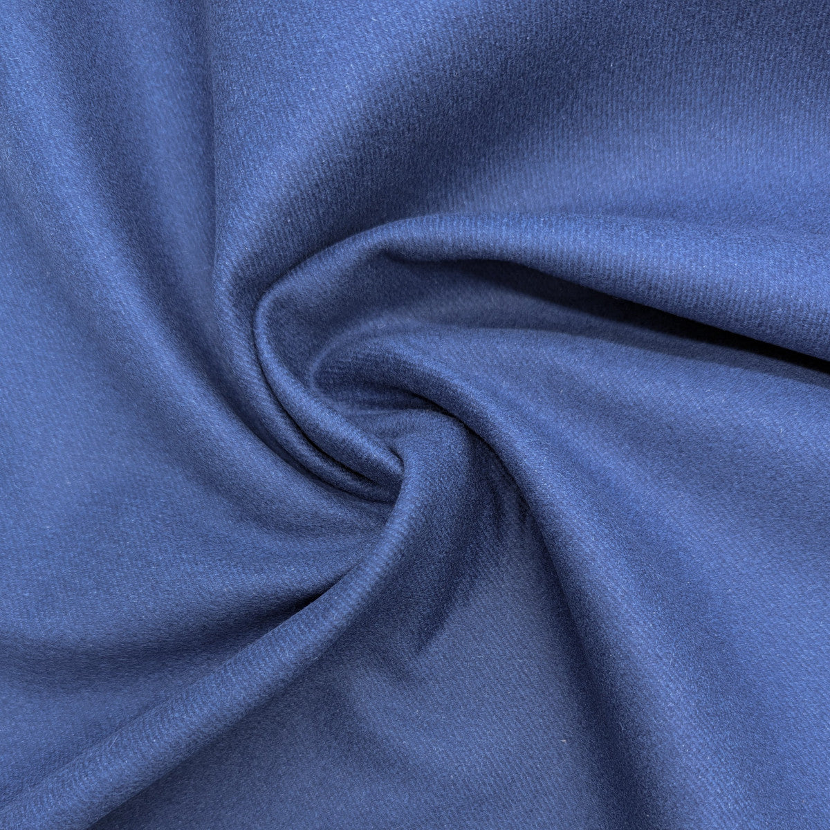 Dark blue wool-rabbit doubleface fabric, trennbar, with a soft texture and gentle folds.