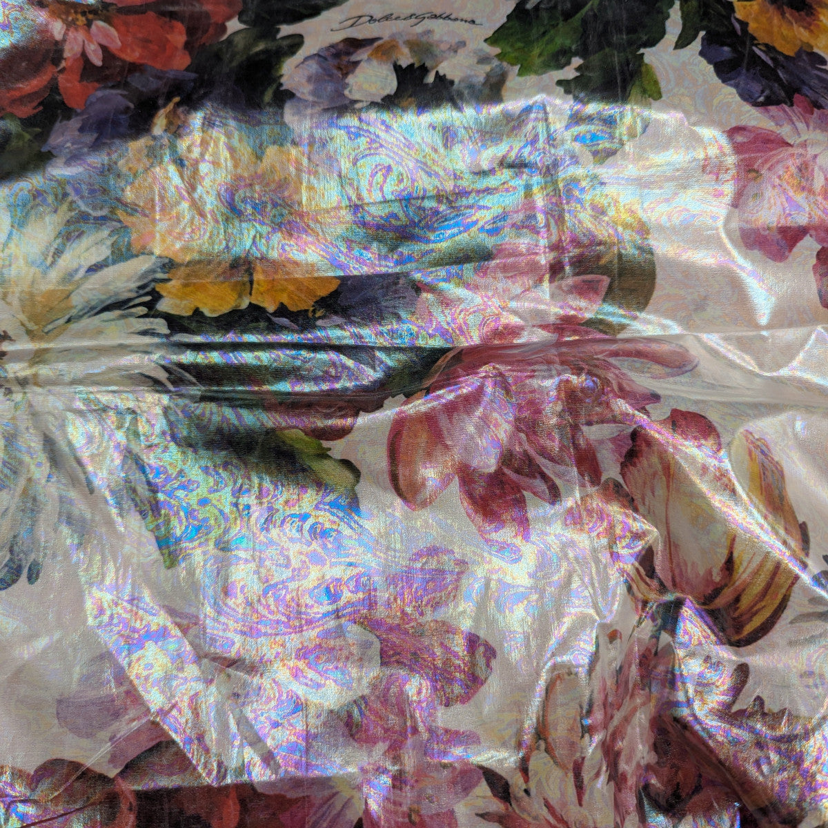 Shimmering D&G deadstock cotton fabric with a vibrant floral print and water-repellent coating.