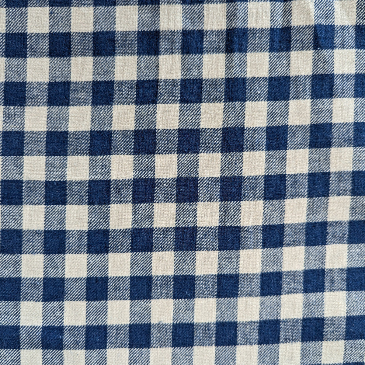 Blue and natural white gingham cotton deadstock fabric, 145 cm wide.