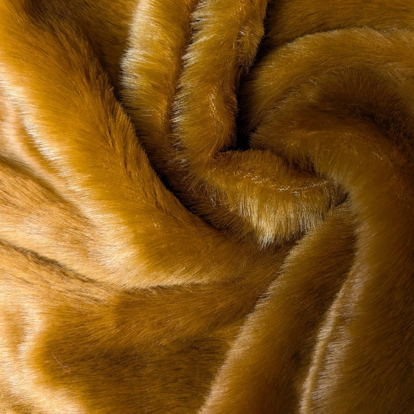 Soft, fluffy Sunset-colored fake fur fabric, 150 cm wide, with a luxurious texture.