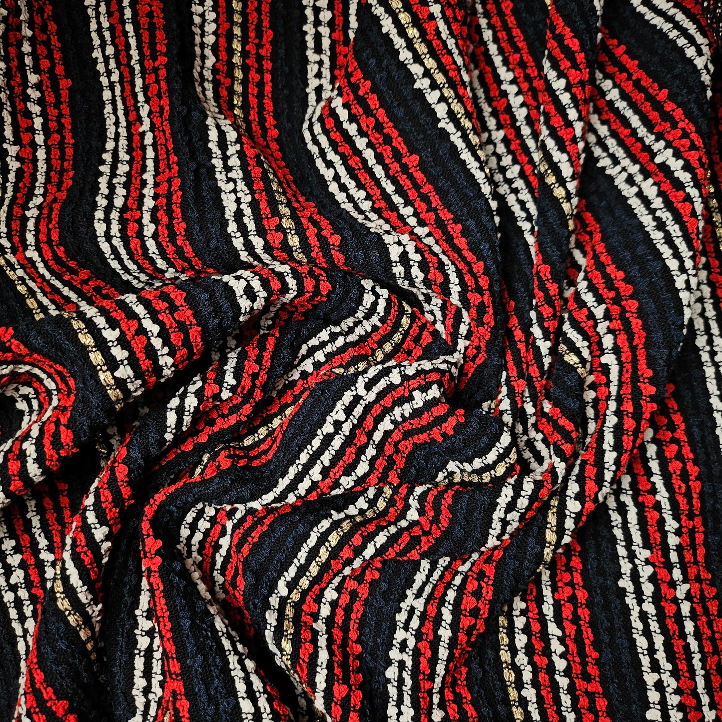 Deadstock G*cci tweed fabric, dark blue with red, white, and gold striped lurex shimmer.