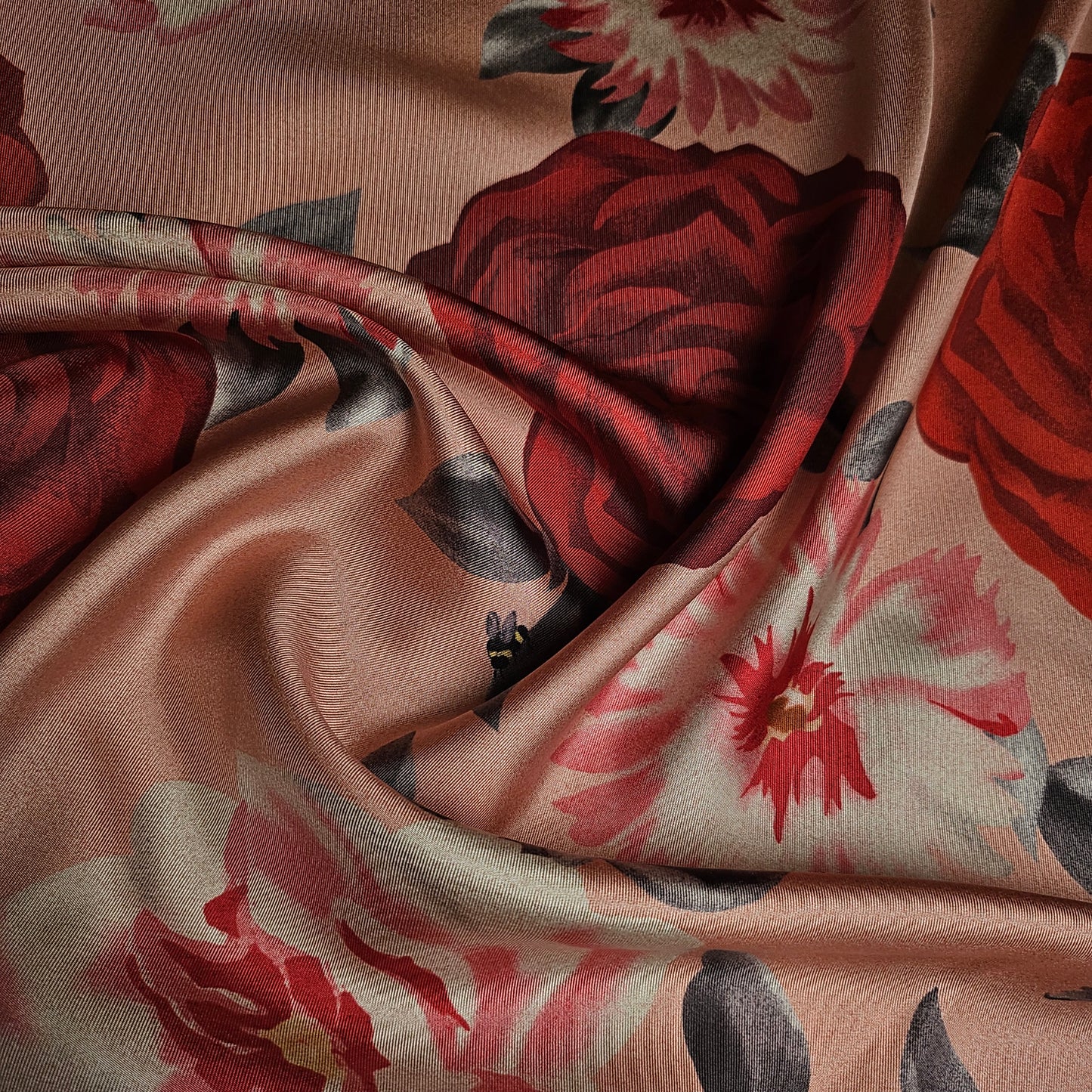 Deadstock Ferragamo silk twill fabric, 50cm, with large red and pink floral print on a peach background.
