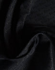 Deadstock Polyesterjacquard, D*or – Logoeinwebung Schwarz (Breite 150 cm) (M2X5X20)