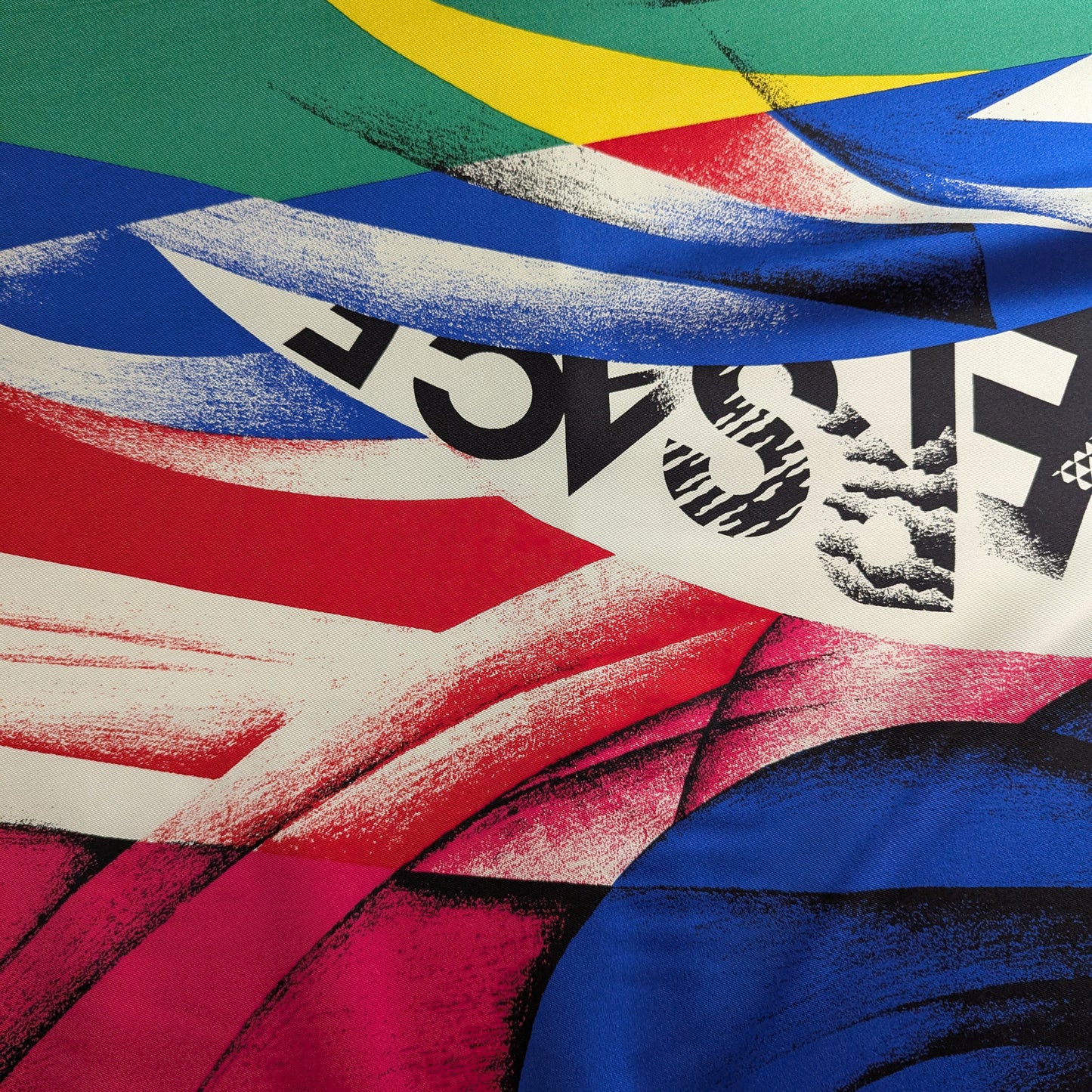 Versace deadstock silk fabric with a vibrant, abstract XXL print in red, blue, green, yellow, and black.