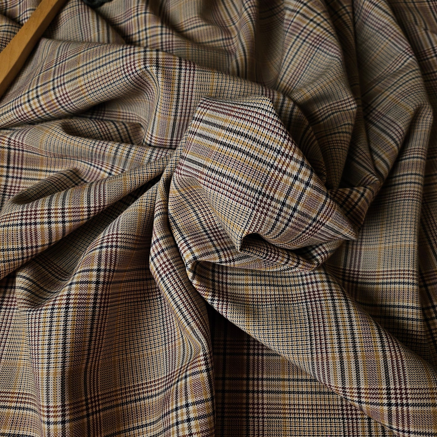 Deadstock Gucci wool fresco fabric, 145cm wide, with a brown, black, and red Prince of Wales plaid pattern.