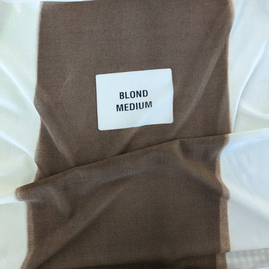 Celine deadstock wool jersey fabric in blonde medium with a white label.