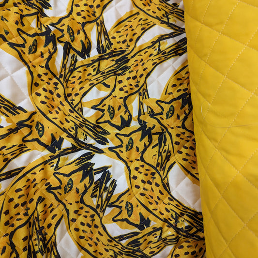 AZ-Factory deadstock quilted fabric: yellow leopard print and plain yellow, both with diamond stitching.