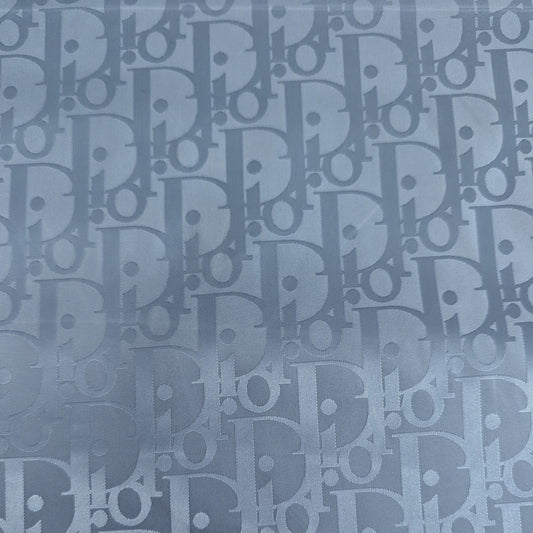 Evertide CD Oblique D##r deadstock nylon fabric, light blue with subtle logo pattern.