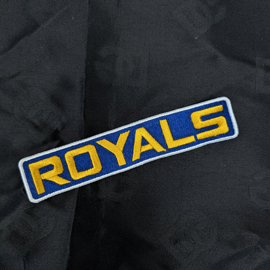 Blue and yellow "ROYALS" embroidered patch, 12x2cm, on black fabric.