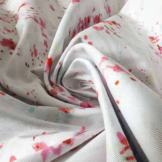 White double-sided Patrizia Pepe deadstock denim fabric with pink, red, and light blue paint splatter print.