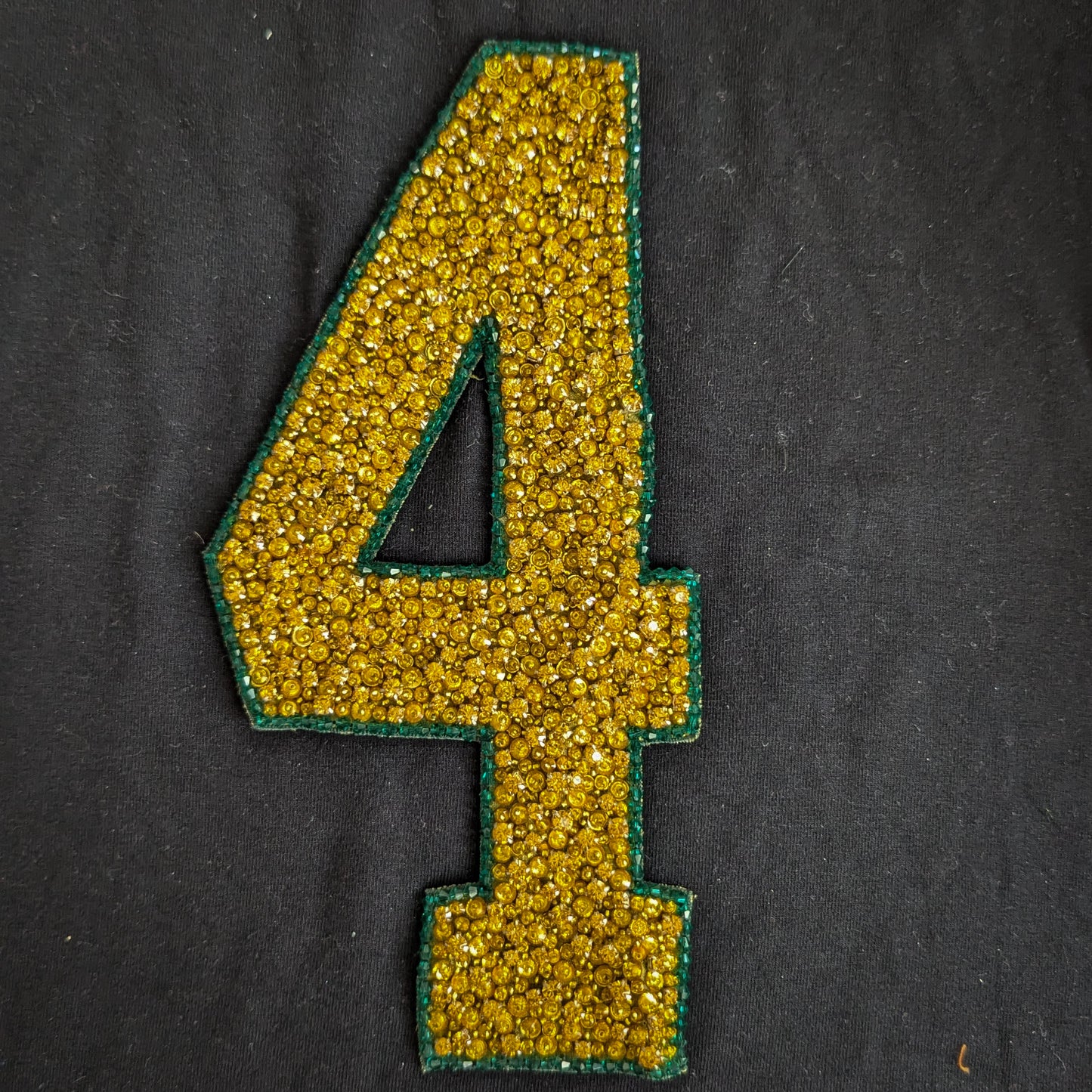 DG "4" patch, gold sequins, green border, 10x19cm, on black fabric.