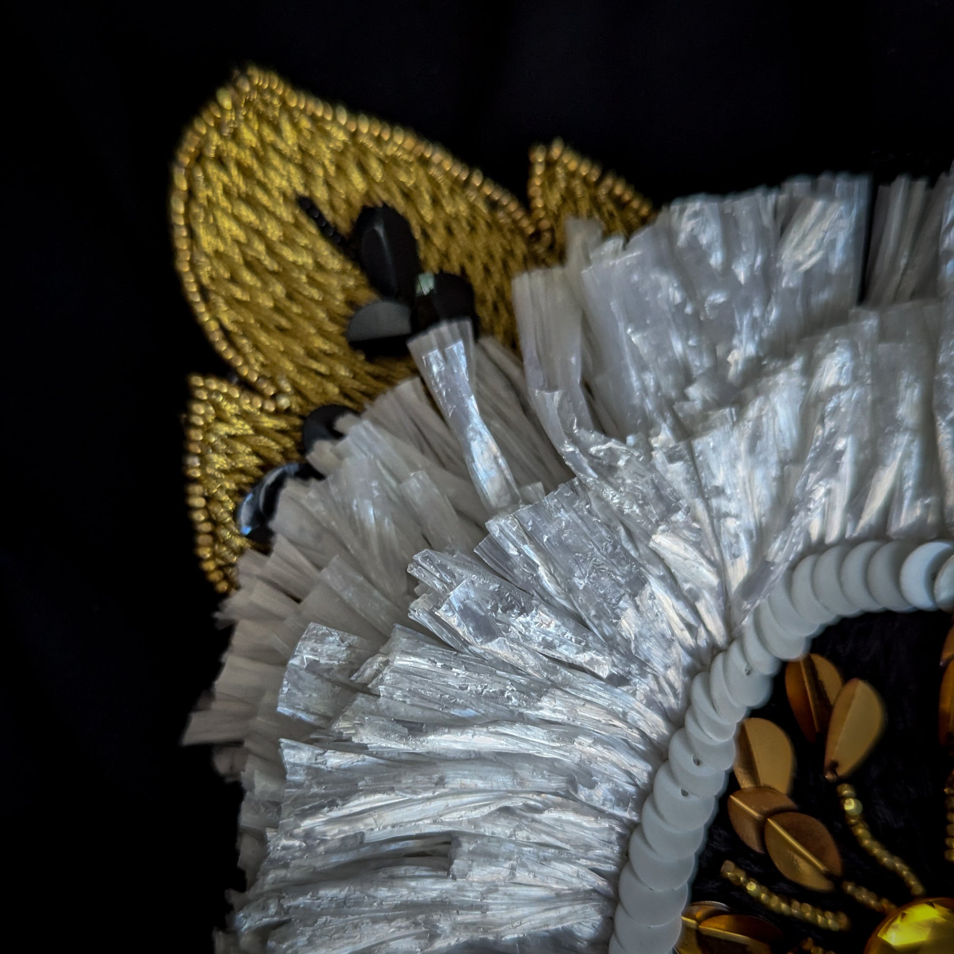 3D D&G Zierelement with gold embroidery, white paillettes, Swarovski stones, and pearls.