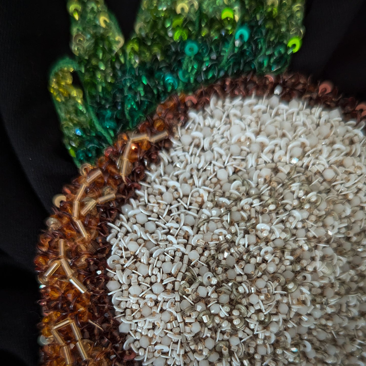 D&G deadstock coconut leaf patch with intricate white beads, brown sequins, and green paillettes.
