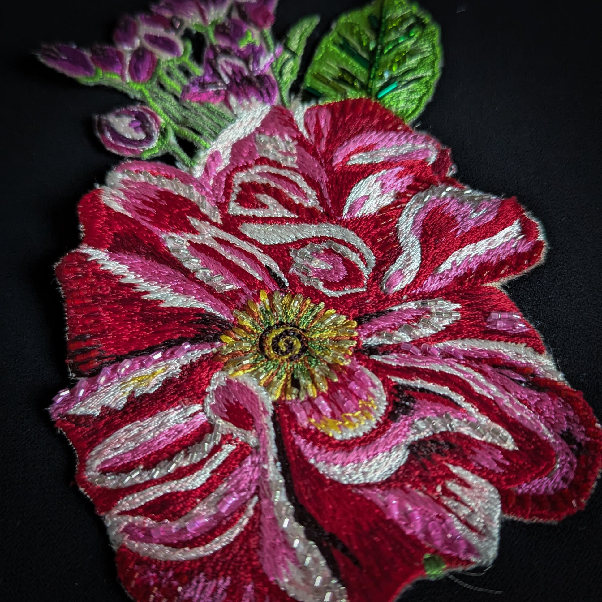 D&G embroidered flower patch, red, pink, and white with pearl beads, green leaves.