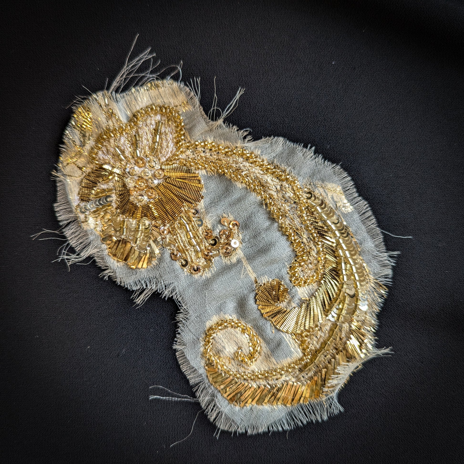 Decorative gold metal embroidery patch, 10x15 cm, with sequins and beads on light fabric.