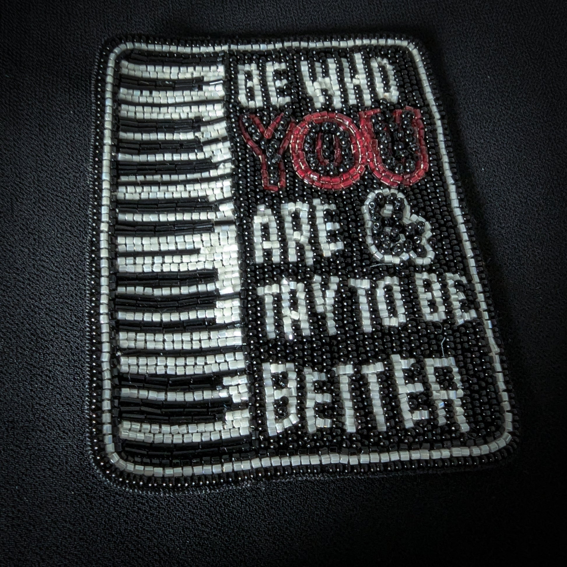Black and white beaded patch, 7x9cm, featuring a piano keyboard and "BE WHO YOU ARE & TRY TO BE BETTER" text.
