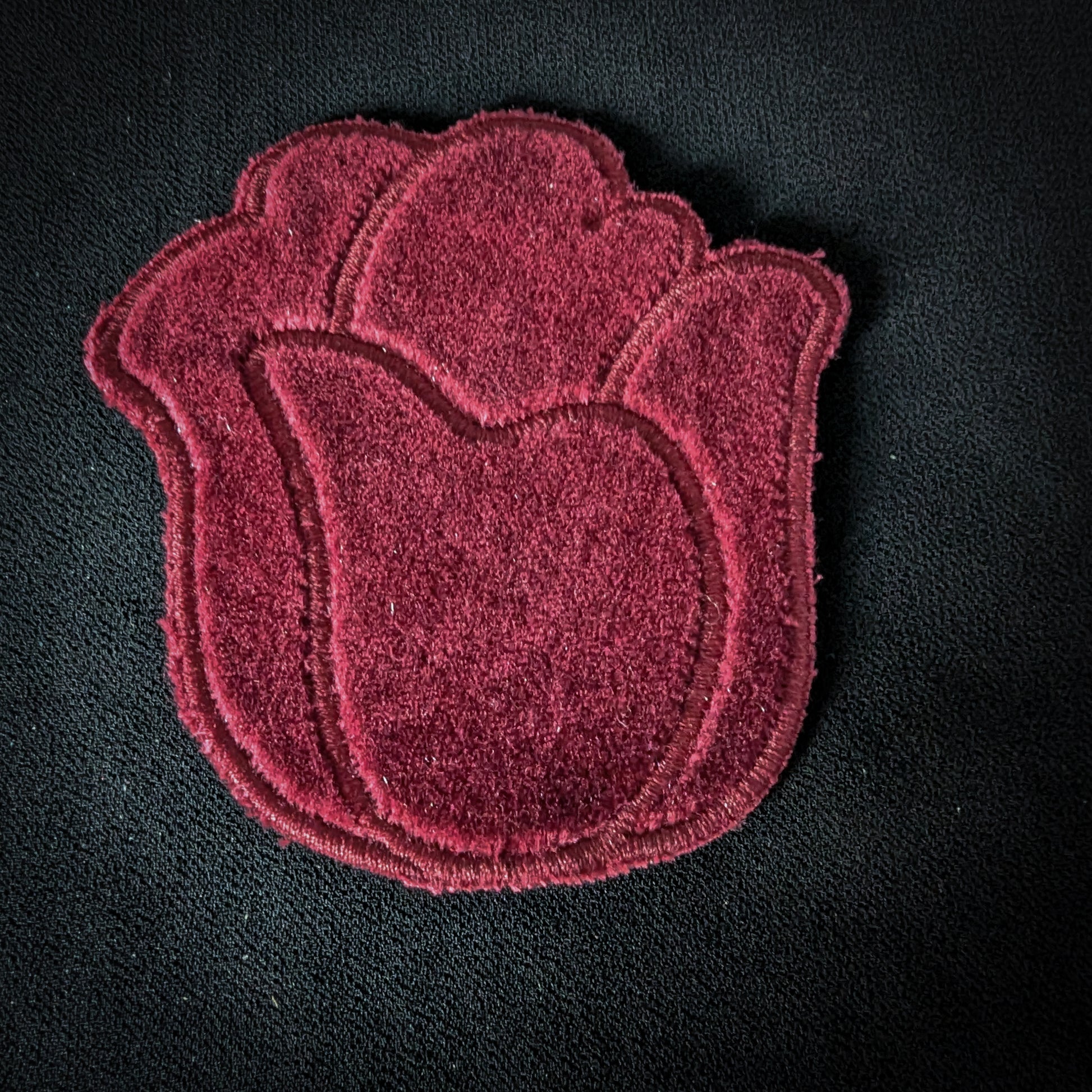 Red velvet D&G tulip patch, 7x7cm, with embroidered details on a black background.