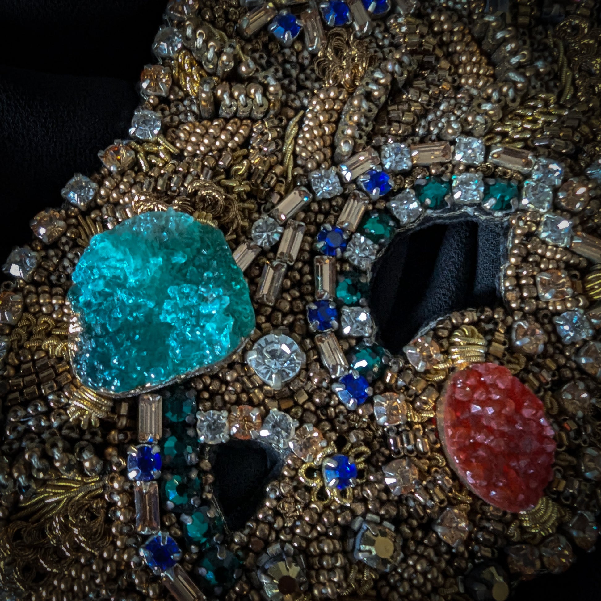 Heavy patch with faceted gemstones, Swarovski stones, and pearls, featuring a large turquoise and red gem.