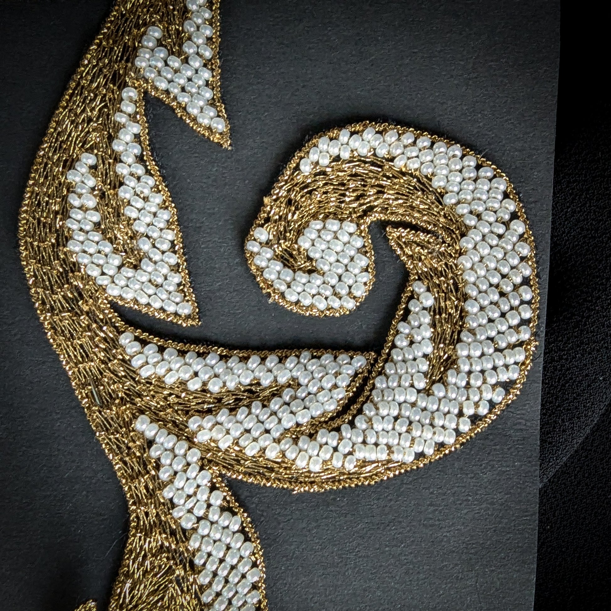 D&G patch with intricate gold metal embroidery and white pearls in a swirling design, 9x14 cm.