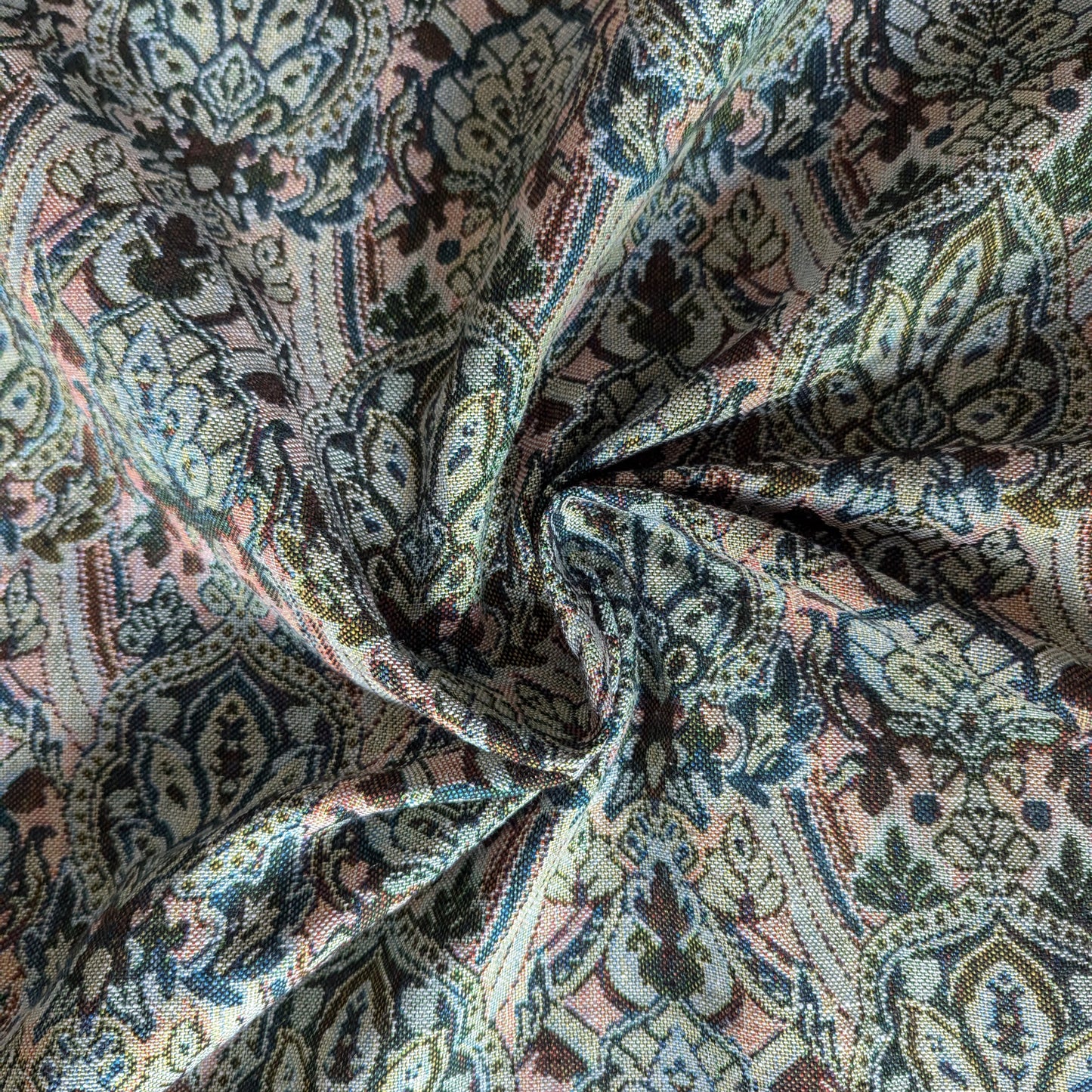 Rich gold cotton-Lurex brocade fabric with intricate, colorful double-sided floral and paisley patterns.