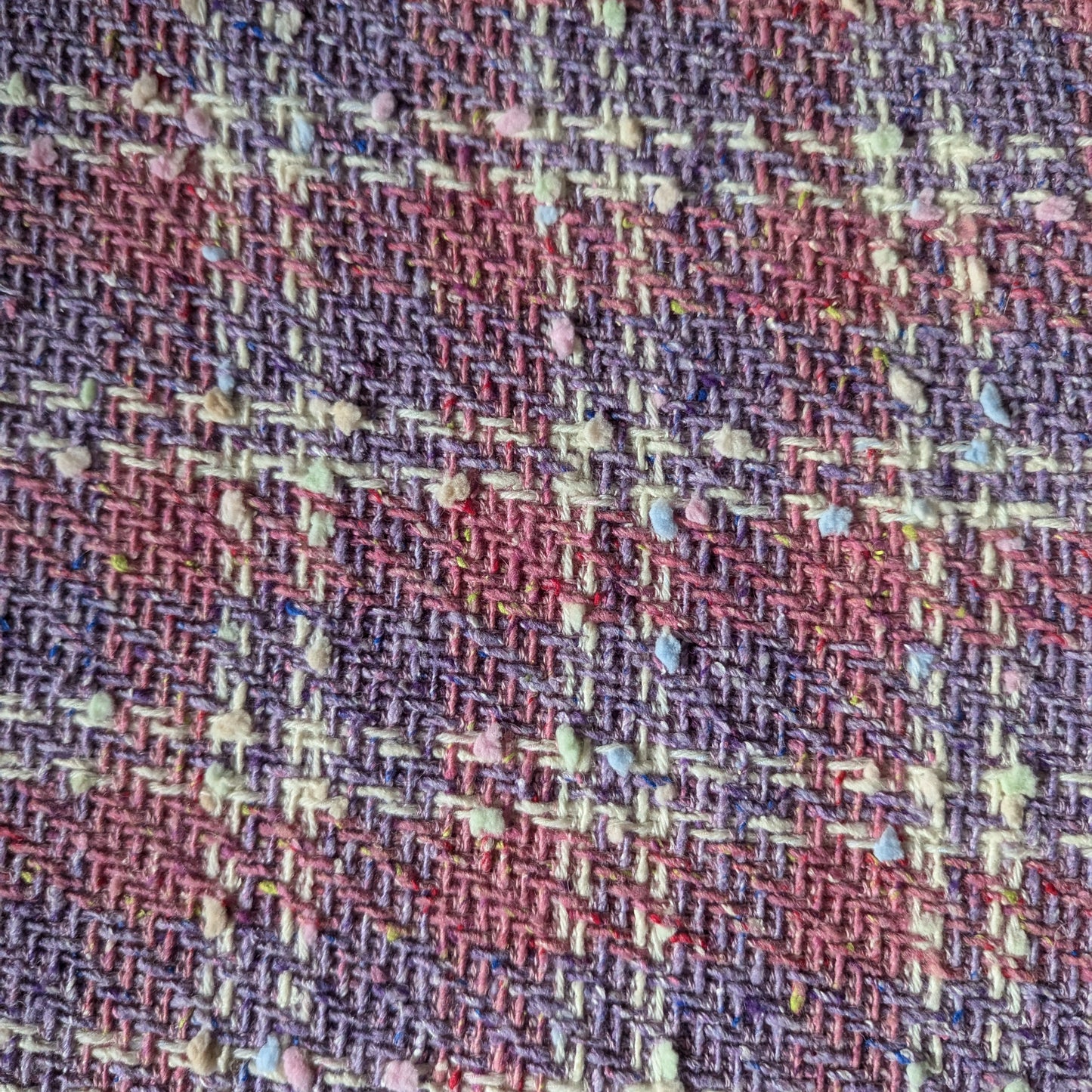 Deadstock G###i tweed fabric, 140cm wide, in Chateau Rose and Bougainvillea Blush Powder with colorful flecks.