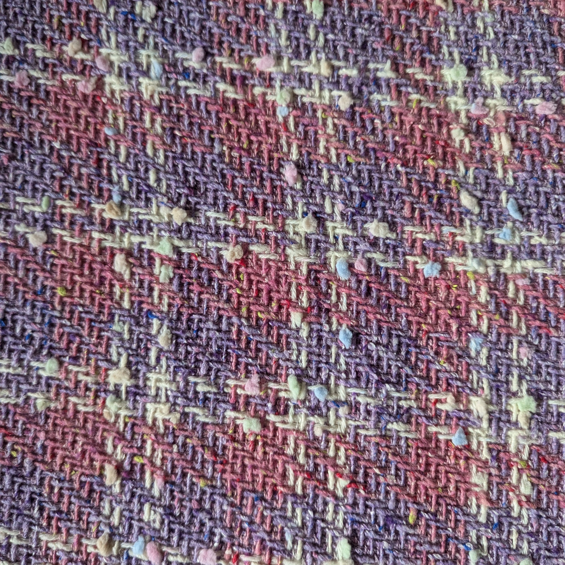 Deadstock G###i tweed fabric, 140cm wide, in Chateau Rose and Bougainvillea Blush Powder with colorful flecks.