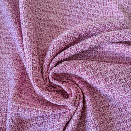 Blush-pink tweed viscose-cotton blend fabric with Lurex, showing a textured weave and soft folds.