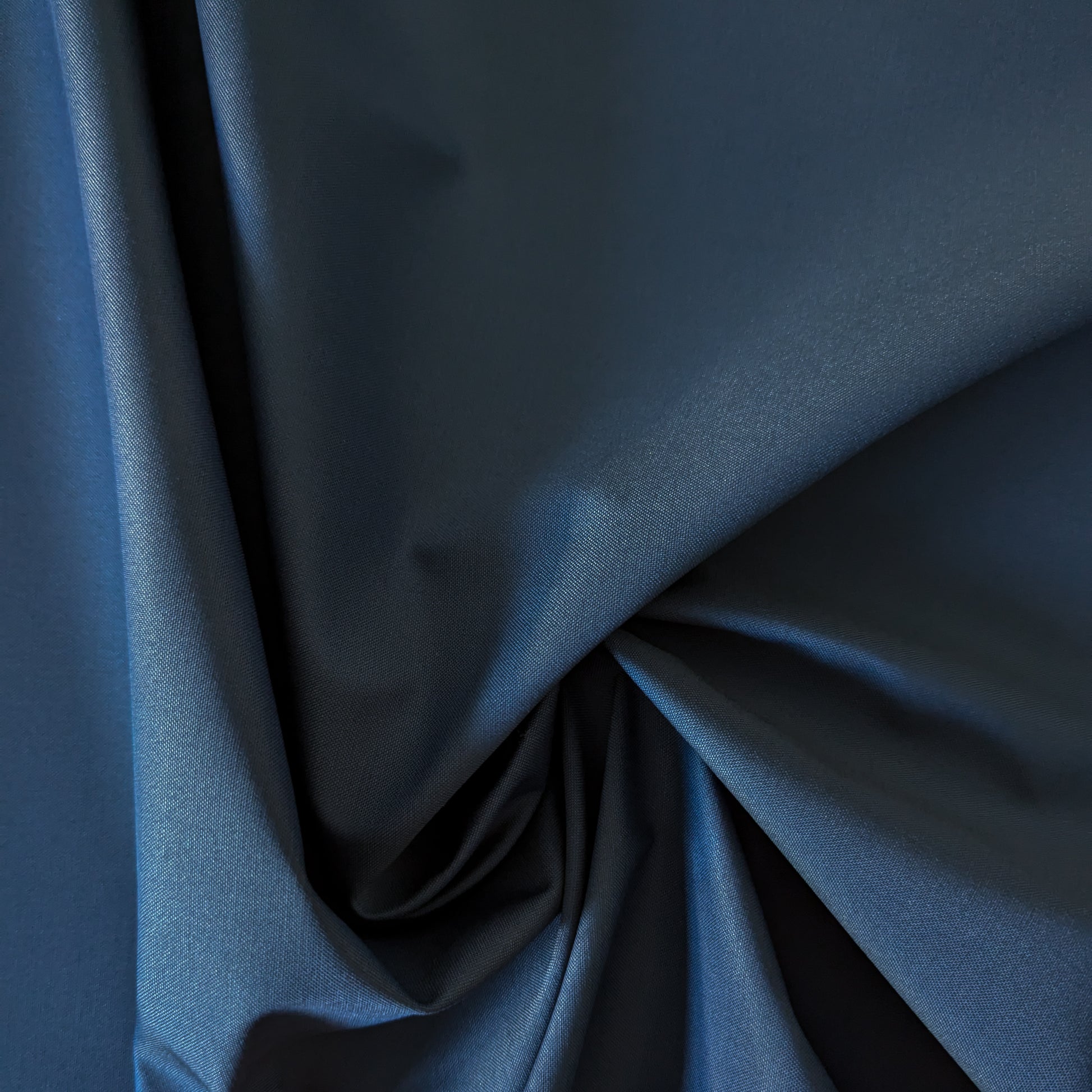 Dark blue wool-polyester doubleface fabric, smooth and softly draped, ideal for apparel.