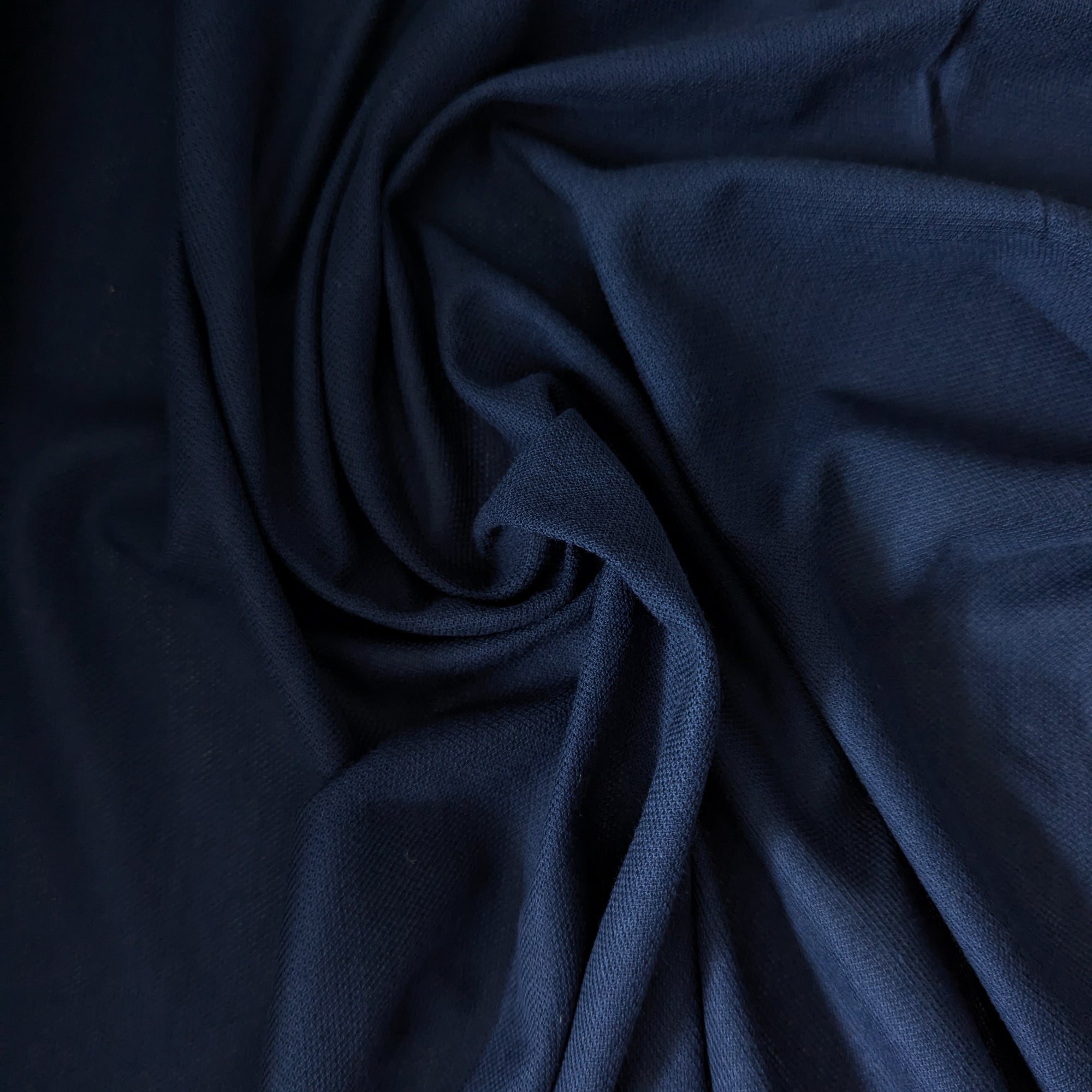 Navy blue L***e deadstock cotton-cashmere piqué fabric, soft, structured, and elegantly draped.
