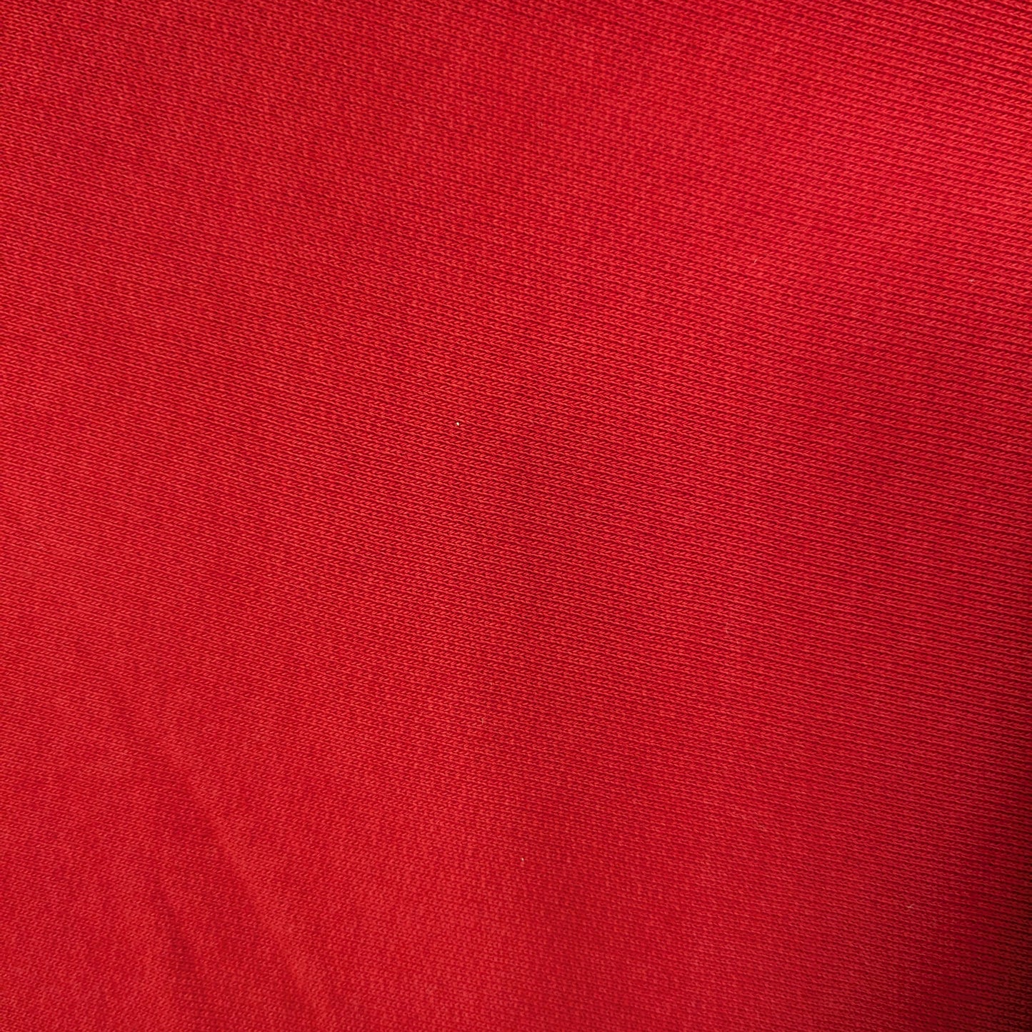 High-quality tomato red C*line deadstock cotton sweatshirt fabric with a subtle sheen.
