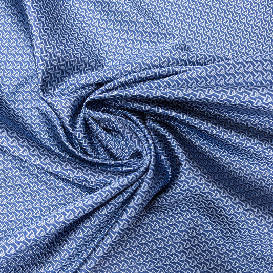 Blue Etr* deadstock tie silk fabric with a subtle white geometric pattern, draped with soft folds.
