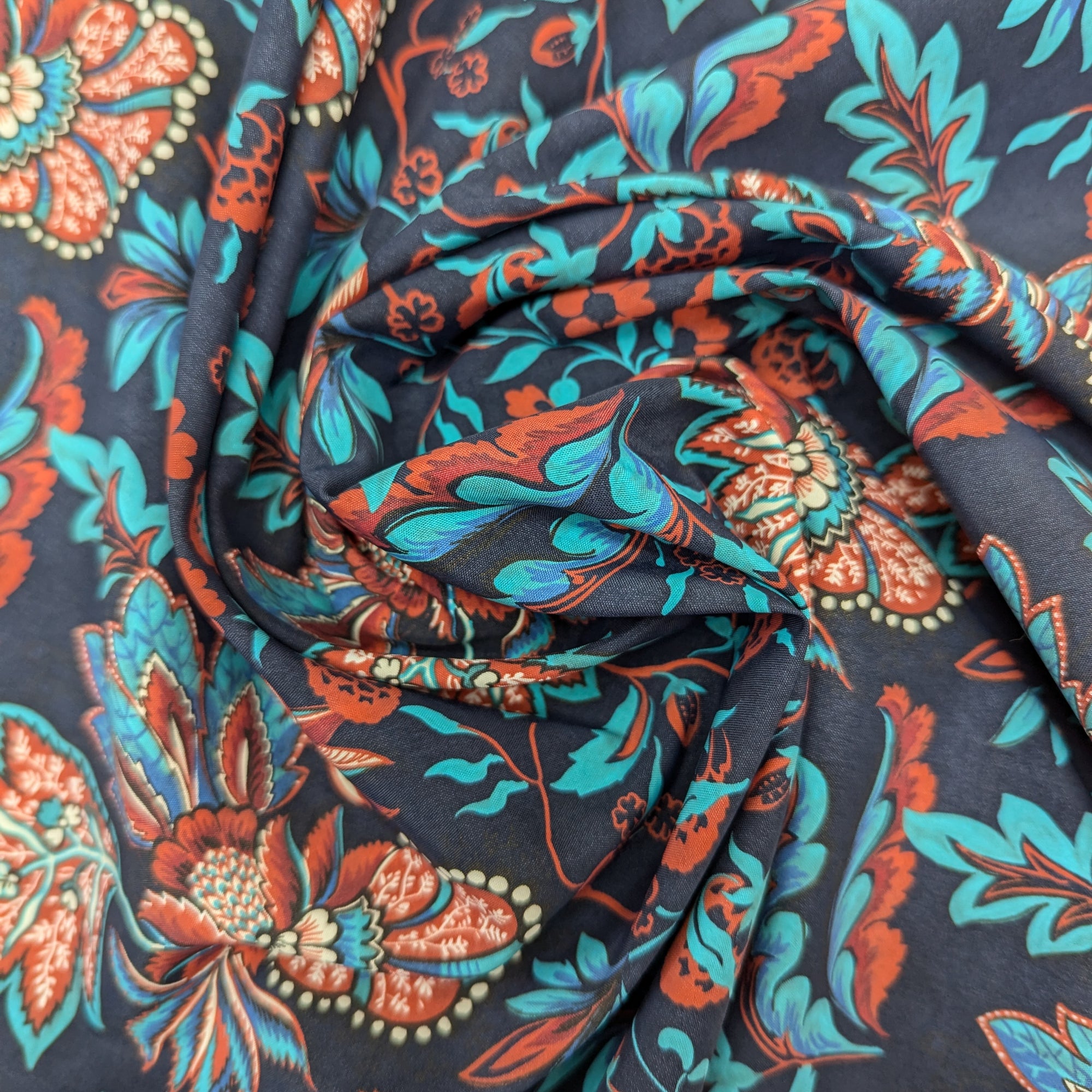 Lightweight Pantone Sky Captain parachute silk with vibrant red and teal floral design, water-repellent.