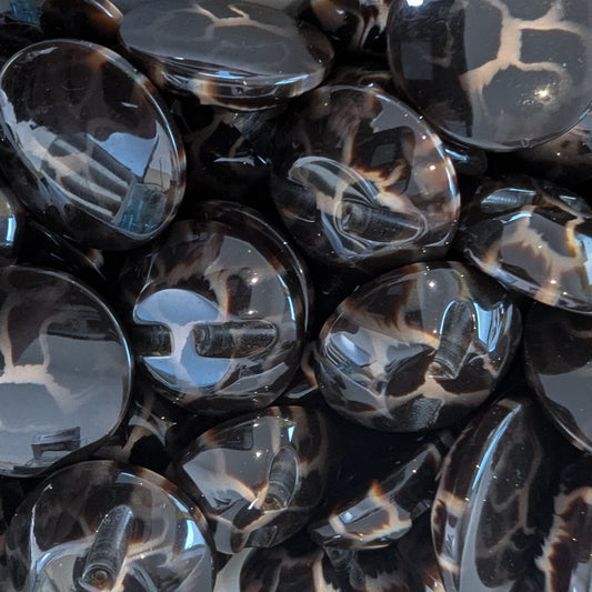 Glossy dark brown plastic buttons with black and beige leopard print, approximately 3 cm.