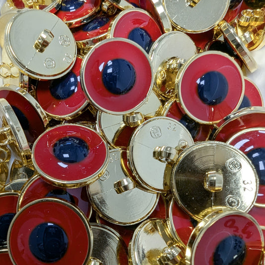 Gold-backed plastic buttons with a red outer ring and a dark blue center, 2 cm diameter.