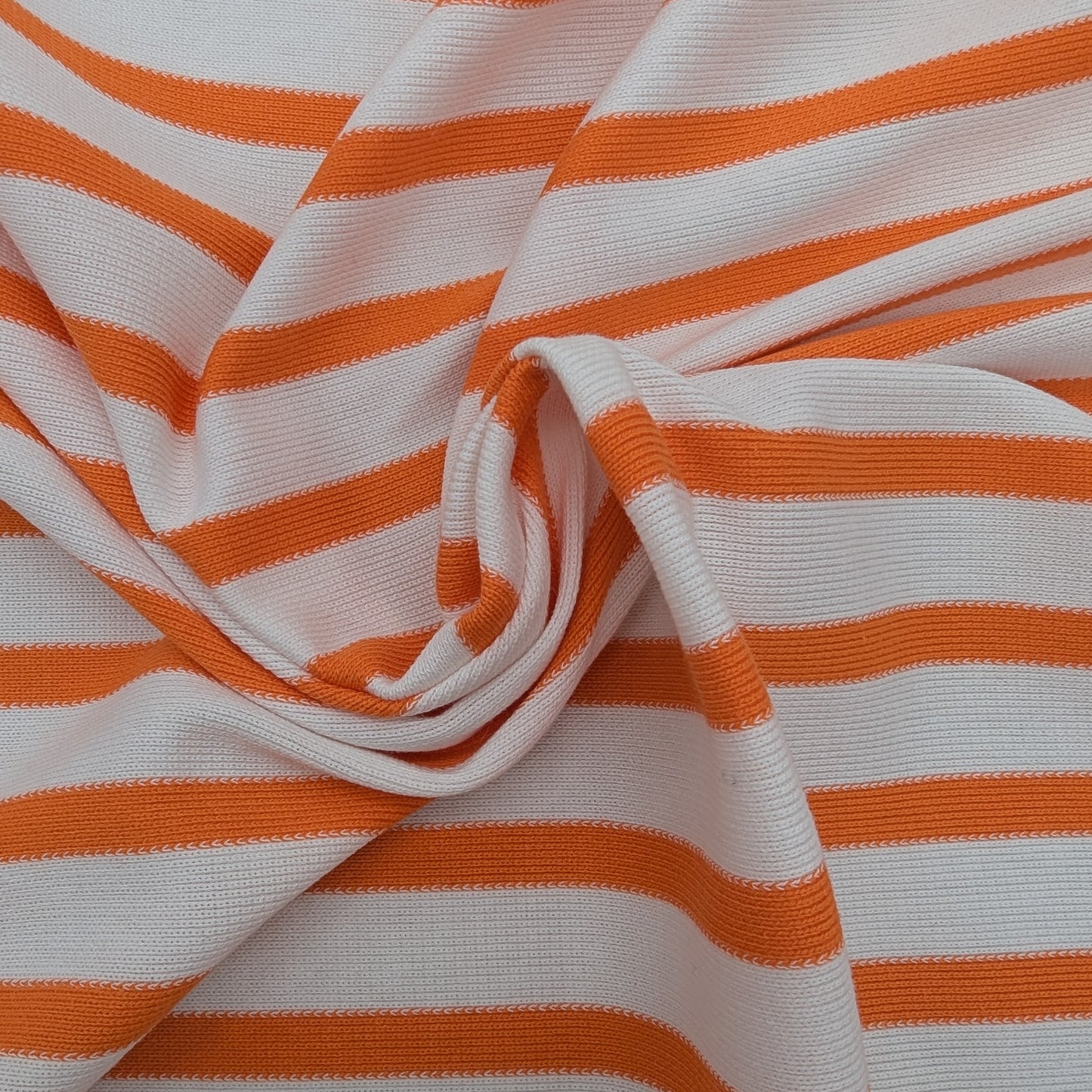 Orange and white striped cotton Punto Milano deadstock designer fabric, 160 cm wide.