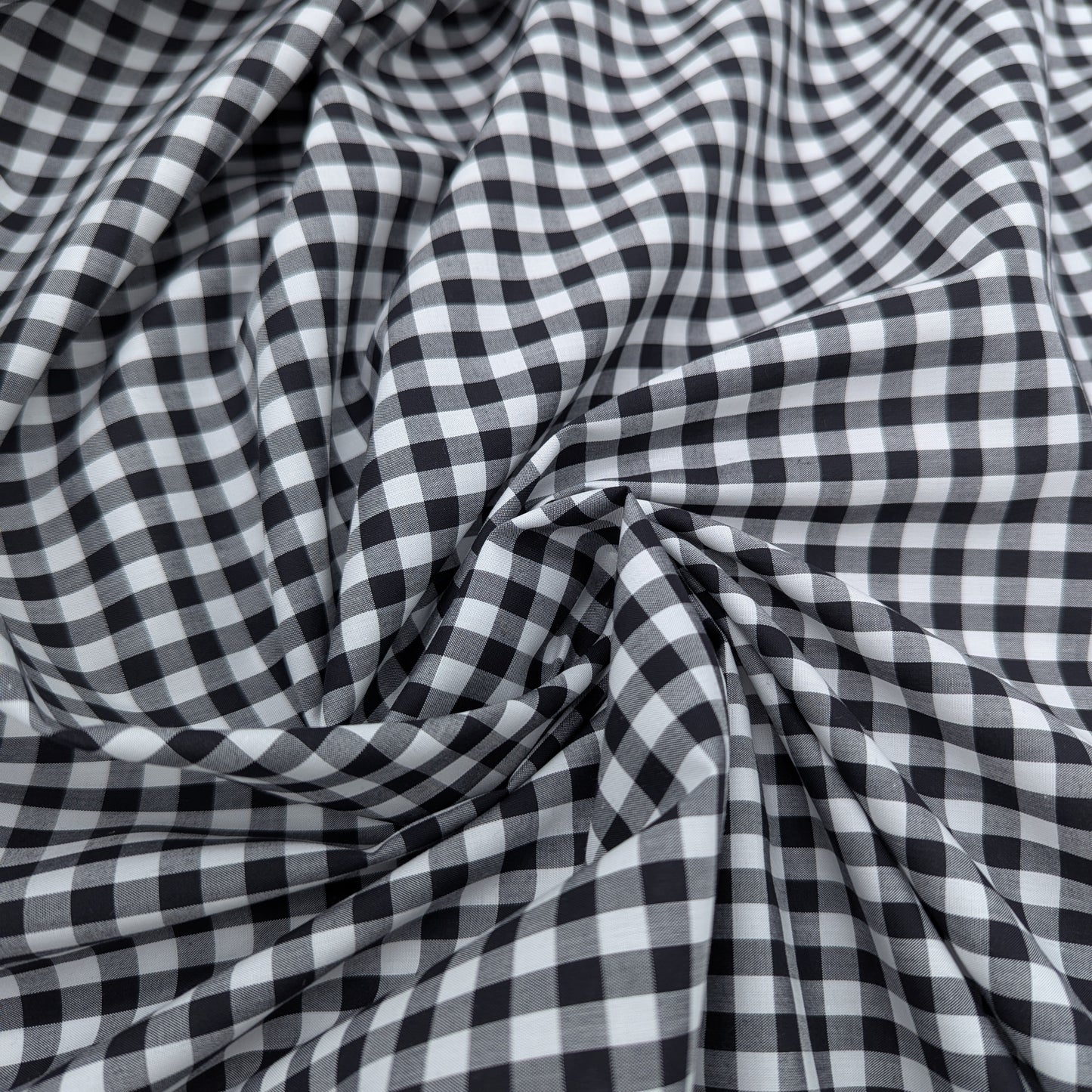 Black and white Vichy check cotton poplin fabric, softly draped, 145 cm wide.