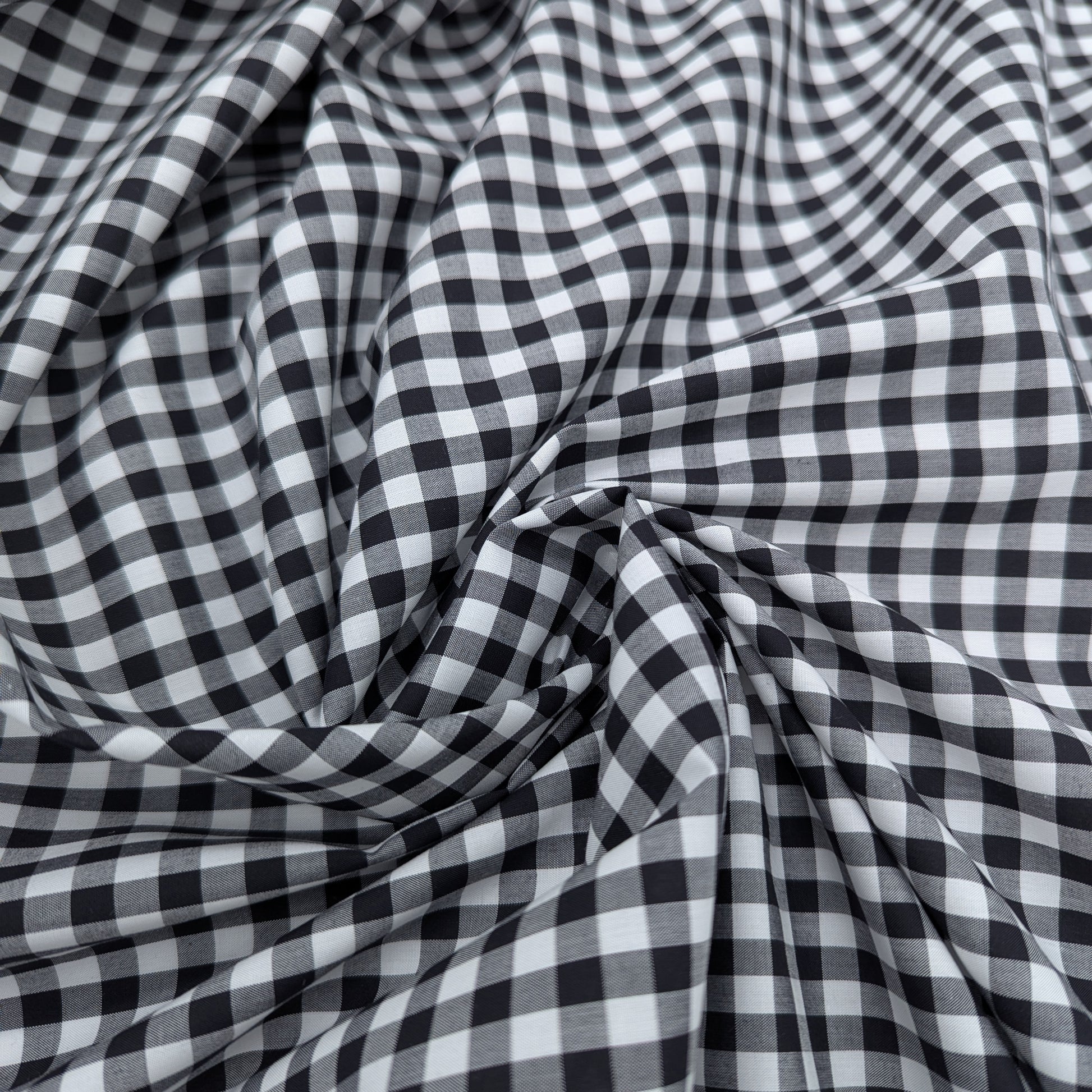 Black and white Vichy check cotton poplin fabric, softly draped, 145 cm wide.