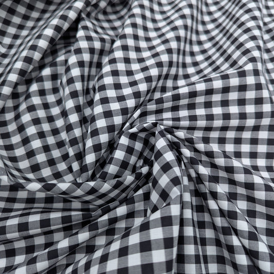 Black and white Vichy check cotton poplin fabric, softly draped, 145 cm wide.
