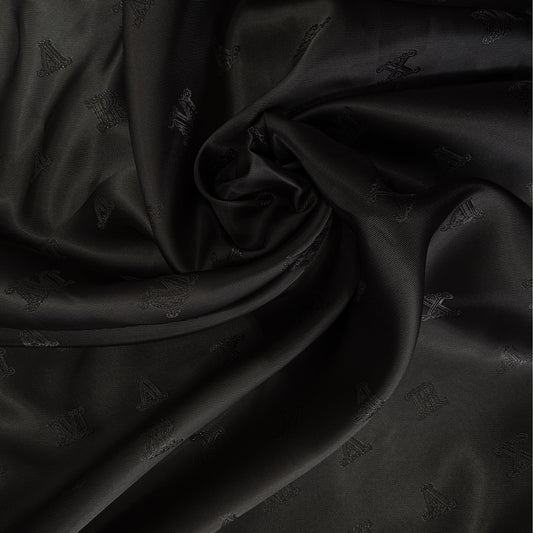 Smooth black Max Mara deadstock viscose lining fabric, subtle logo pattern.