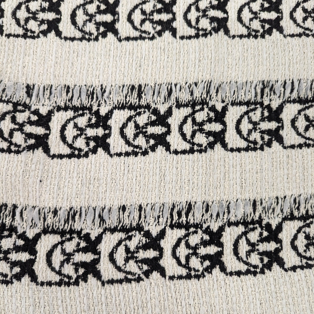 Pinko deadstock cotton tweed fabric, 150cm wide, with black Love Birds pattern on Coconut Milk white.