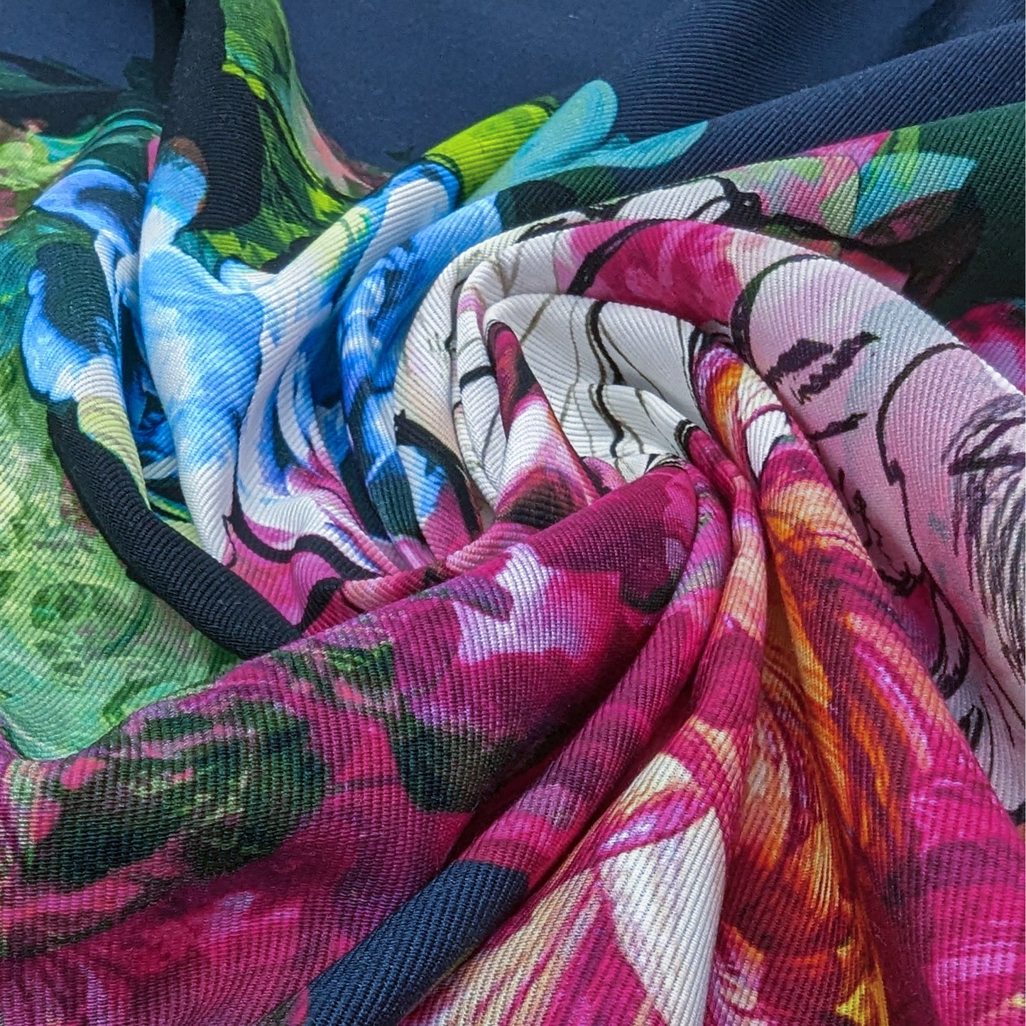 Vibrant deadstock denim panel with a colorful floral print in pink, blue, green, and white.