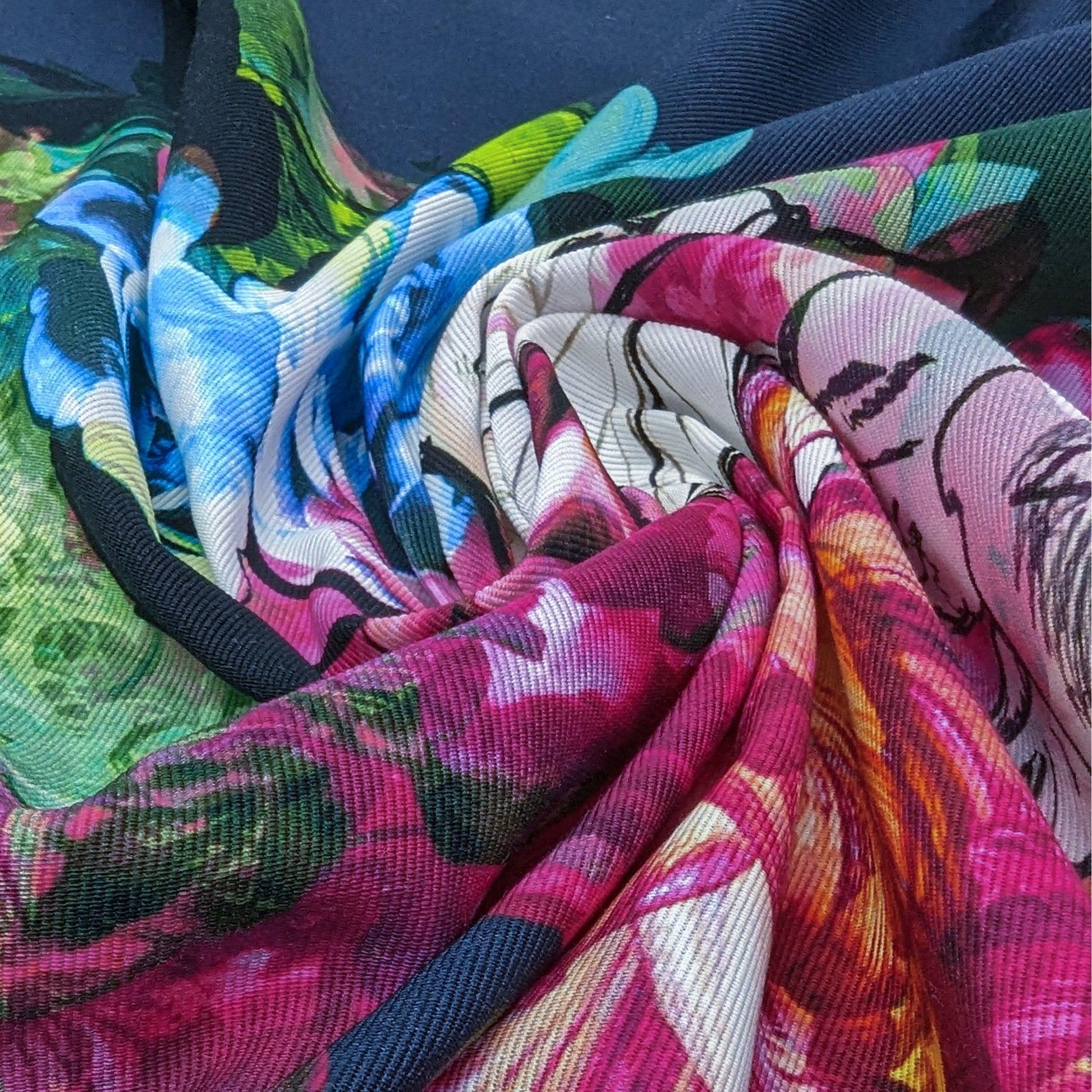 Vibrant deadstock denim panel with a colorful floral print in pink, blue, green, and white.