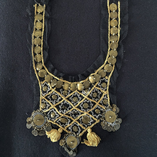 Gold metal ornament on black tulle, 20x50cm, with sequins, tassels, and intricate lattice design.