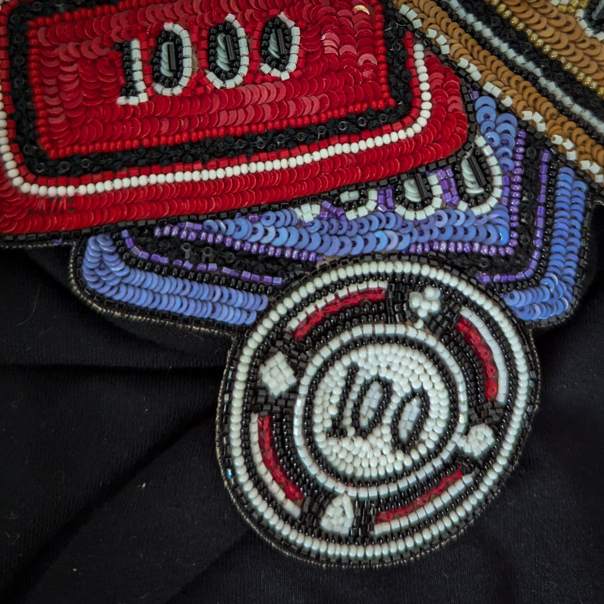 D&G poker chip patch with red, purple, and white sequins and beads, 12x13cm.