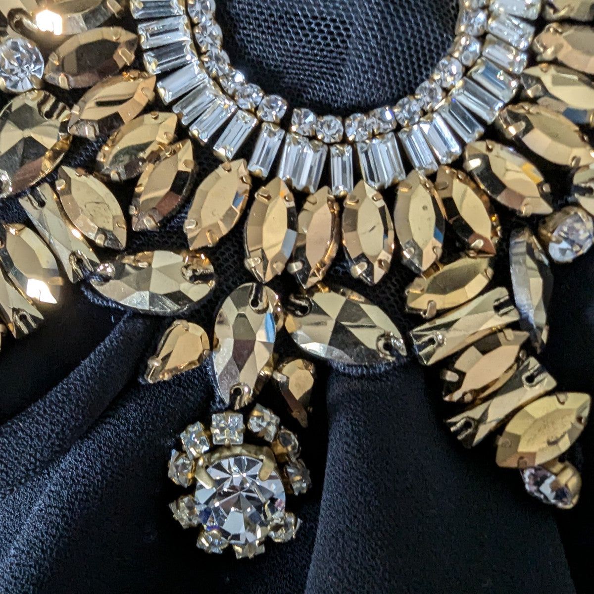 D&G heavy patch with gold and clear Swarovski stones, pearls, on black fabric.