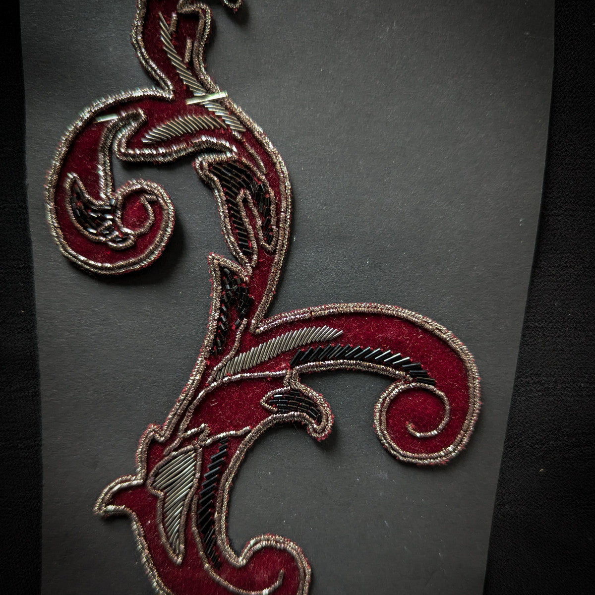 D&G velvet and metal embroidery patch, 10x14cm, with ornate red and silver scrollwork.