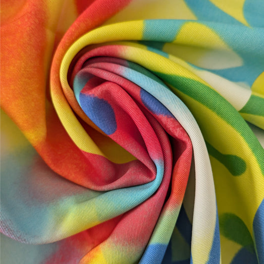 D&G deadstock wool twill fabric panel with vibrant graffiti print in red, orange, yellow, and blue.